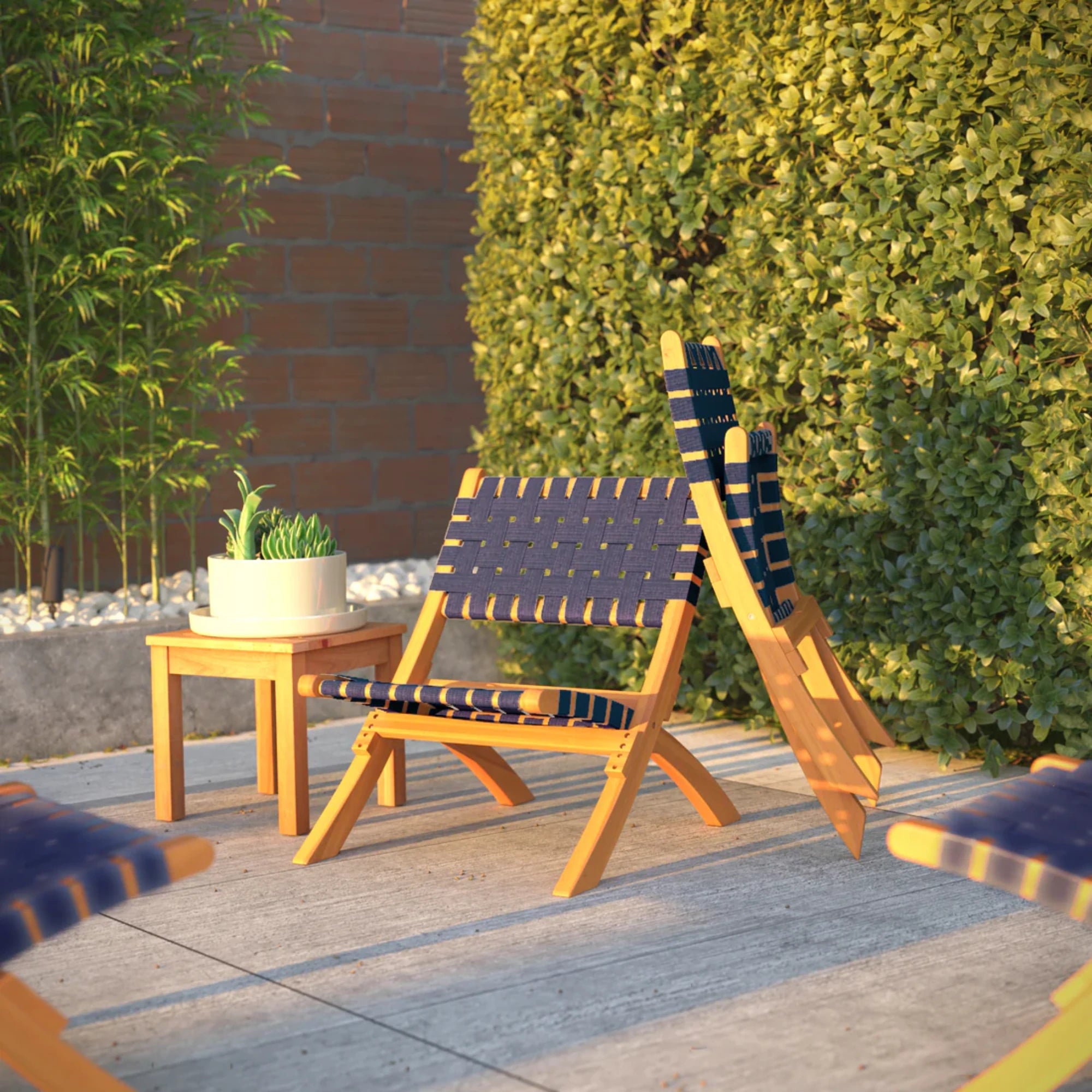 Well Traveled Living Sava Folding Chair in Navy Blue Webbing | Novaselectes